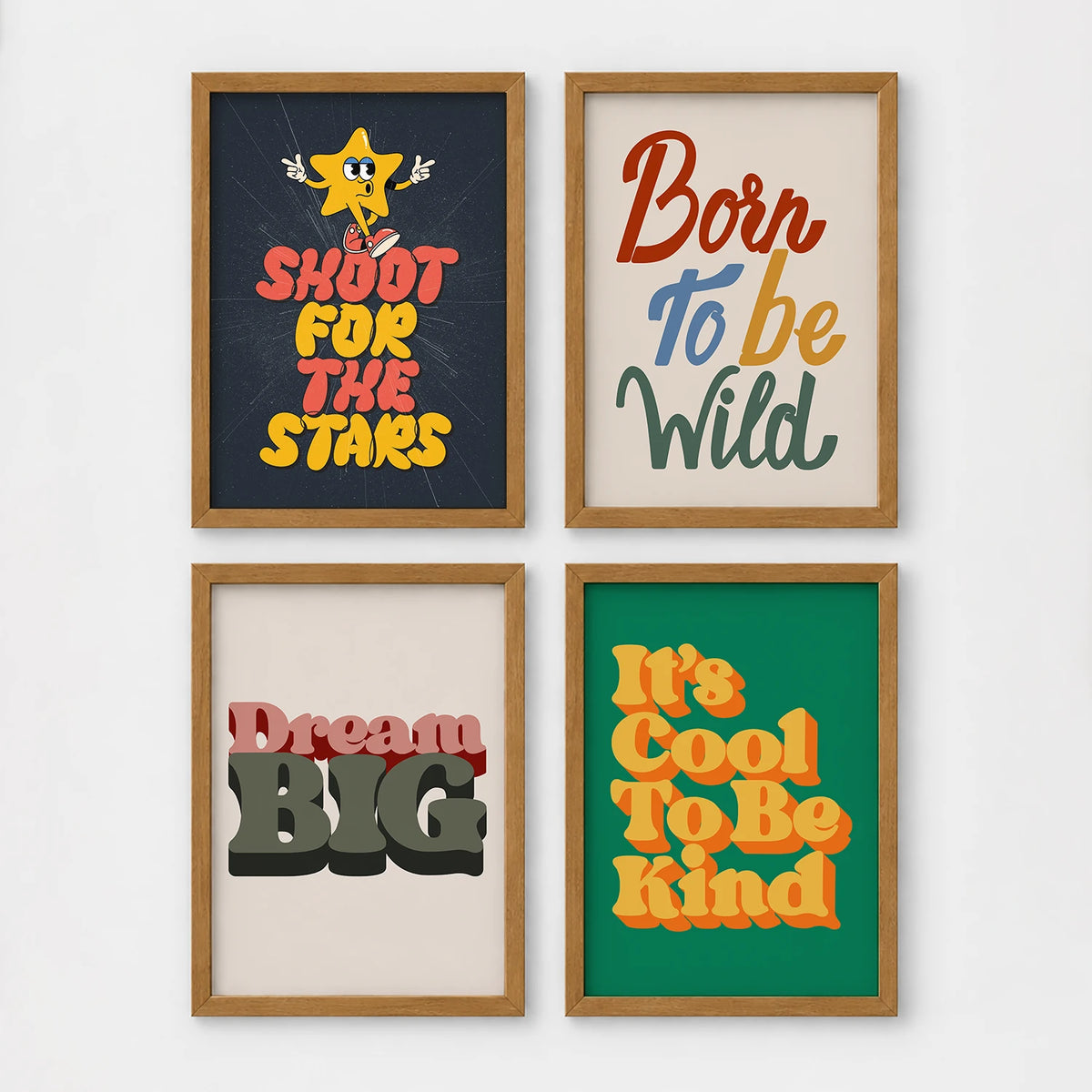 Set of 4 framed prints, retro groovy typographic quote prints: "Shoot For The Stars" typography with a star character; "Born To Be Wild" typography; "Dream Big" typography; and "It's Cool To Be Kind" typography — unframed