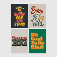 Set of 4 framed prints, retro groovy typographic quote prints: "Shoot For The Stars" typography with a star character; "Born To Be Wild" typography; "Dream Big" typography; and "It's Cool To Be Kind" typography — unframed