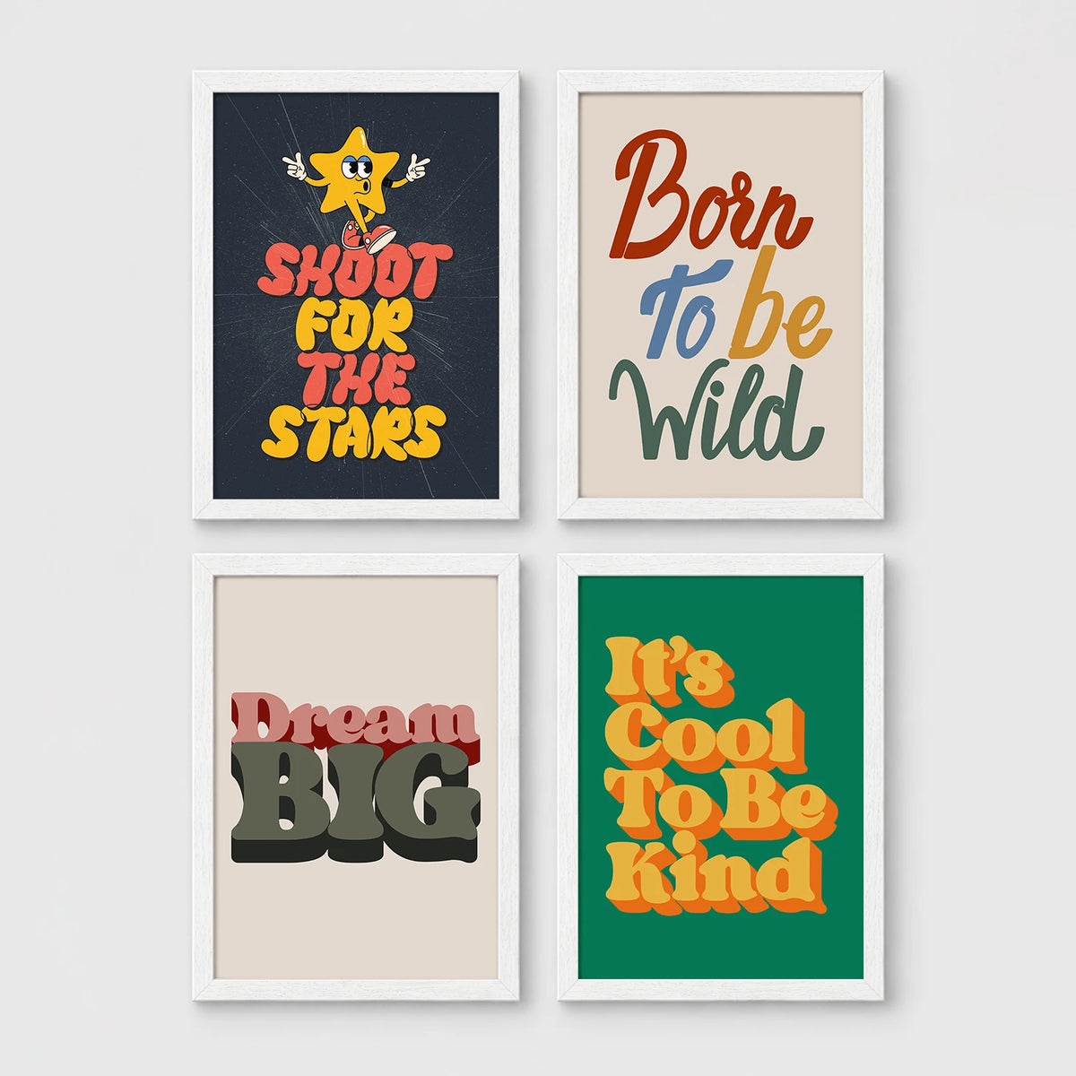 Set of 4 framed prints, retro groovy typographic quote prints: "Shoot For The Stars" typography with a star character; "Born To Be Wild" typography; "Dream Big" typography; and "It's Cool To Be Kind" typography — unframed