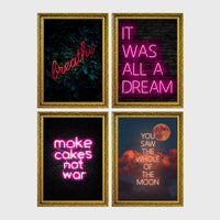 Set of 4 framed prints, pink typographic quote prints: "Let's Stay Home" bold retro typography; a peace-sign hand illustration filled with uplifting text; "This Kitchen Is For Dancing" bold retro typography; and a second peace-sign hand illustration filled with uplifting text — unframed