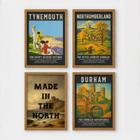 Set of 4 framed prints, vintage North East England travel posters: a "Tynemouth - For Happy Seaside Outings" vintage travel poster; a "Northumberland - For Joyful Country Rambles" vintage travel poster; "Made in the North" over a coastal castle landscape; and a "Durham - For Cobbled Adventures" vintage travel poster — unframed