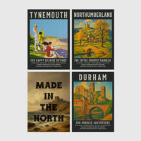 Set of 4 framed prints, vintage North East England travel posters: a "Tynemouth - For Happy Seaside Outings" vintage travel poster; a "Northumberland - For Joyful Country Rambles" vintage travel poster; "Made in the North" over a coastal castle landscape; and a "Durham - For Cobbled Adventures" vintage travel poster — unframed