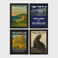 Set of 4 framed prints, vintage Northumberland travel posters: a "Behold! Northumberland, England" coastal landscape poster; a "The Lure of Northumberland" poster of riders at night; a "Northumberland - For Joyful Country Rambles" village poster; and a "Holy Island Northumberland" poster featuring a seal — unframed