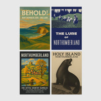 Set of 4 framed prints, vintage Northumberland travel posters: a "Behold! Northumberland, England" coastal landscape poster; a "The Lure of Northumberland" poster of riders at night; a "Northumberland - For Joyful Country Rambles" village poster; and a "Holy Island Northumberland" poster featuring a seal — unframed