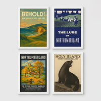 Set of 4 framed prints, vintage Northumberland travel posters: a "Behold! Northumberland, England" coastal landscape poster; a "The Lure of Northumberland" poster of riders at night; a "Northumberland - For Joyful Country Rambles" village poster; and a "Holy Island Northumberland" poster featuring a seal — unframed