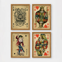 Set of 4 framed prints, French-style illustrated floral posters: "Fleurs et Feuilles" abstract flower vase illustration; "Galerie de Fleurs" illustration of a woman with flowers; "Le Jardin" wildflower garden illustration; and "Saison du Marché" pink flower illustration — unframed