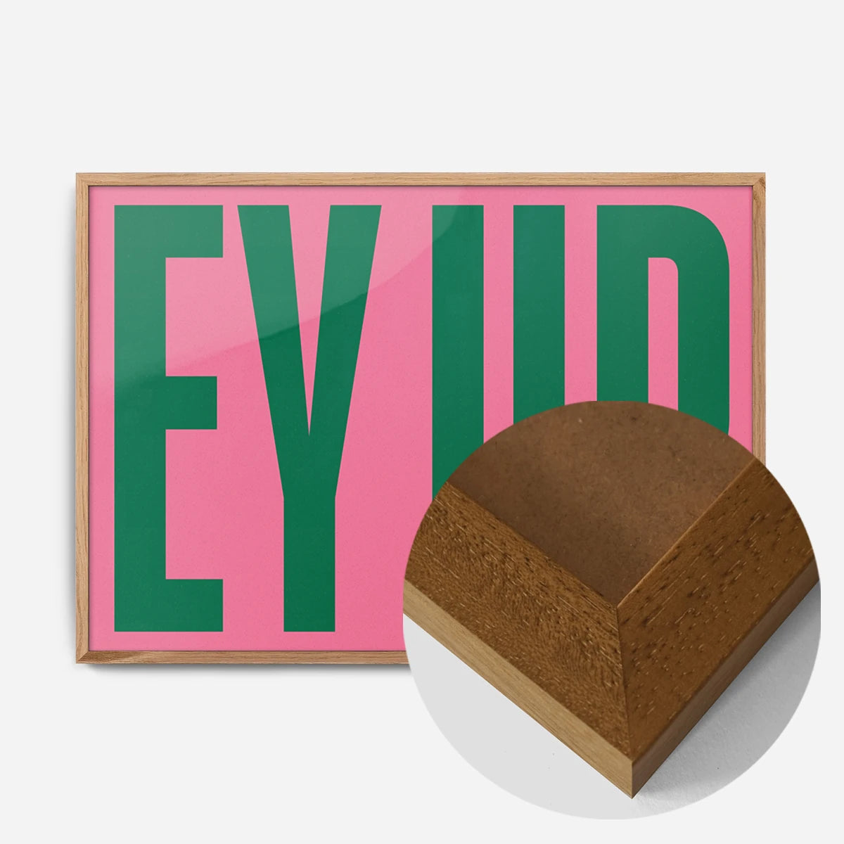 bold pink green typography print in an oak wood frame, side profile