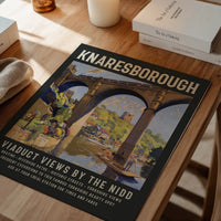 The print of Knaresborough's stone viaduct and punt boats on a dining room wall