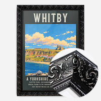Whitby harbour travel poster print in a black ornate frame, side profile