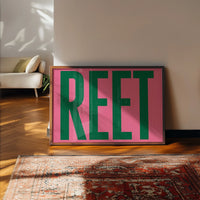 The print brightening a kitchen wall with bold pink and green lettering