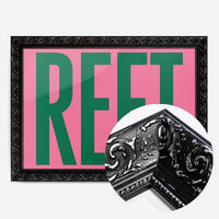 bold green reet typography print in a black ornate frame, side profile