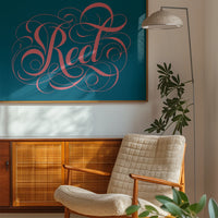 The print in coral pink and teal above a bedroom bed