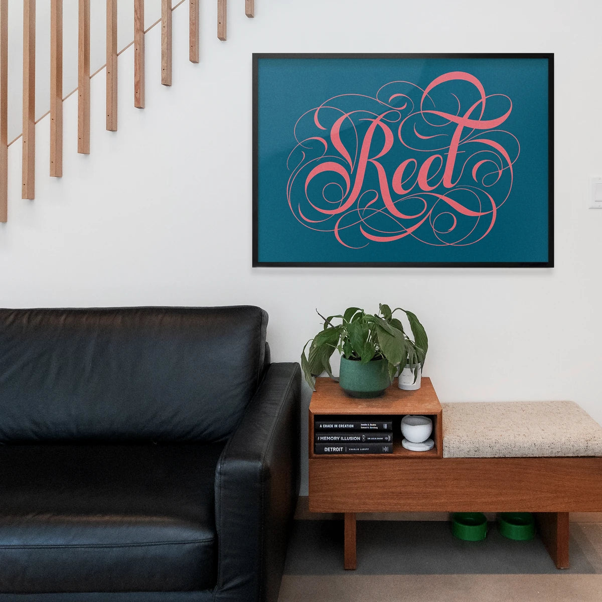 Landscape calligraphy wall art styled in a home office