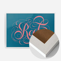 swirly calligraphy lettering print in a white wood frame, side profile