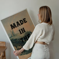 Made in the North print displayed on a living room wall, typography over a castle ruin landscape