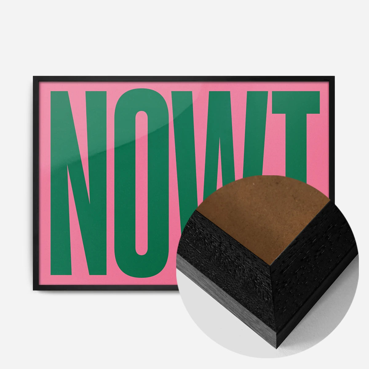 bold green nowt typography print in a black wood frame, side profile