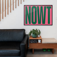 Bold green and pink typography wall art in a home office