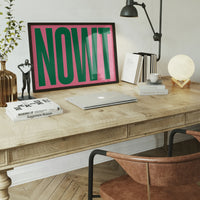 Landscape typography print with giant green letters in a dining room