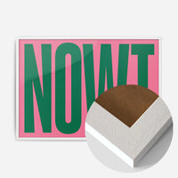 bold green nowt typography print in a white wood frame, side profile