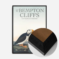 vintage puffins on coastal rock print in a black wood frame, side profile