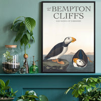 Vintage puffins on coastal rock artwork on a home office wall