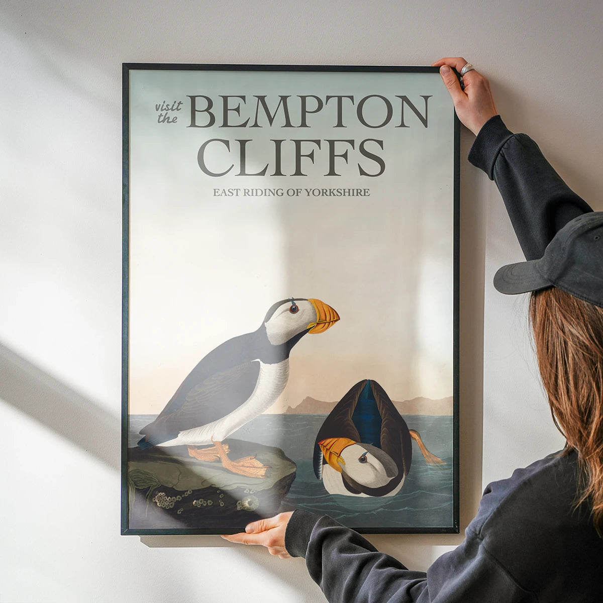 The print of puffins and Yorkshire coast in a kitchen