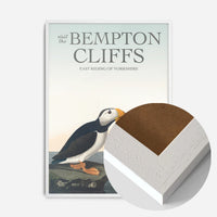 vintage puffins on coastal rock print in a white wood frame, side profile