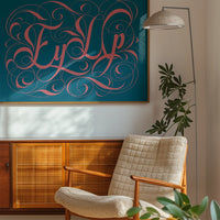 The print with swirly pink lettering on teal displayed in a bedroom