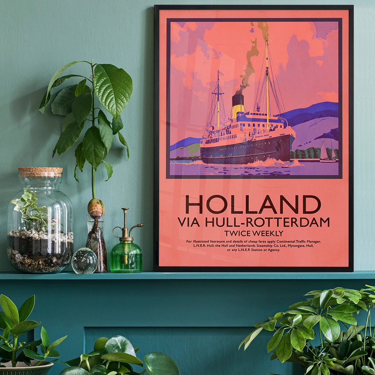 The print of a vintage steamship above a home office desk