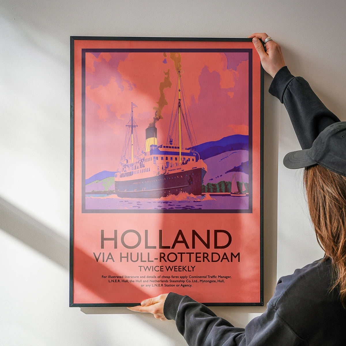 Vintage travel poster of a Hull Rotterdam steamship in a kitchen
