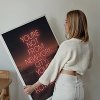 Rotherham typography print in red neon displayed on a living room wall