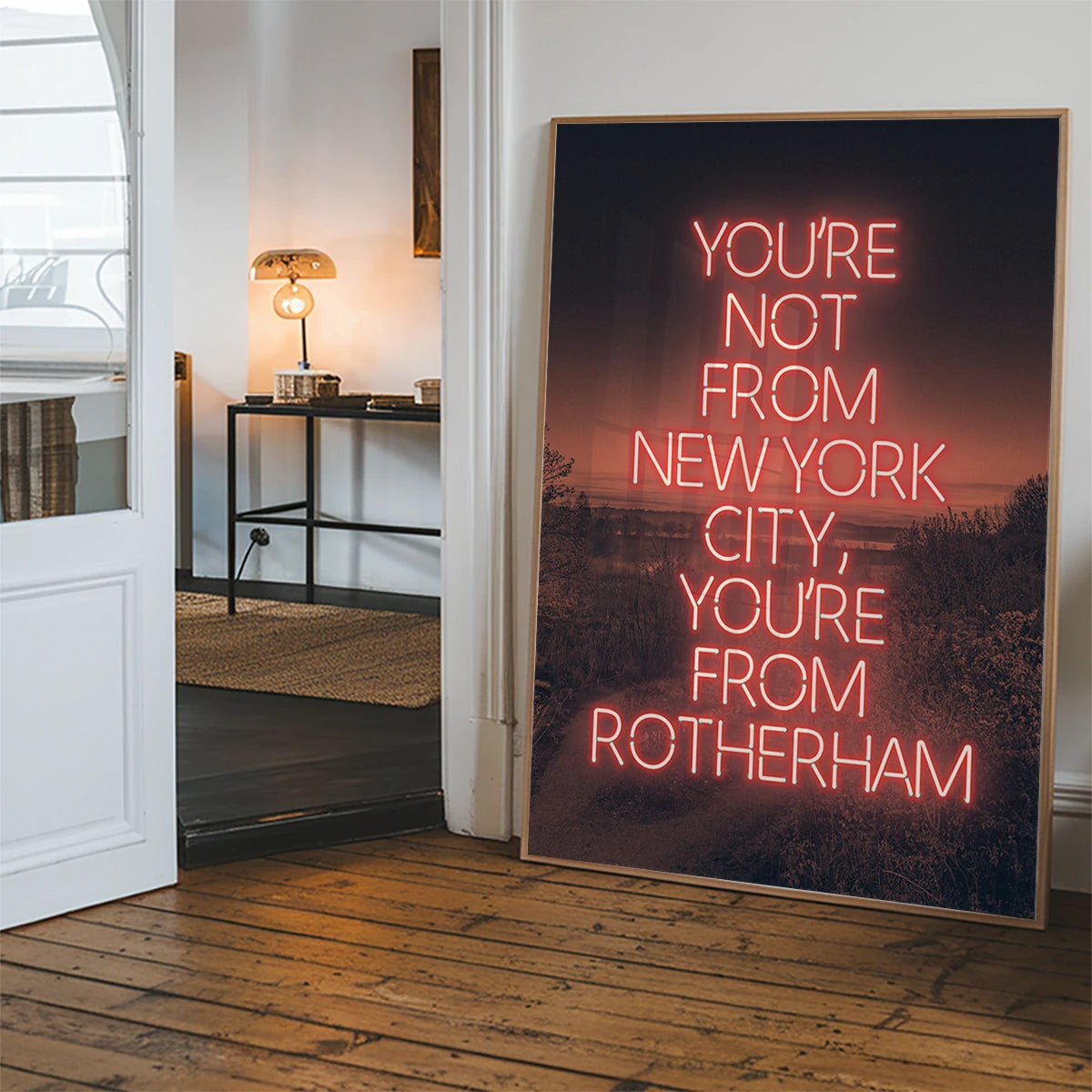 Red neon quote print styled in a hallway as a bold statement piece