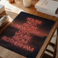 Red neon quote poster framed in a dining room