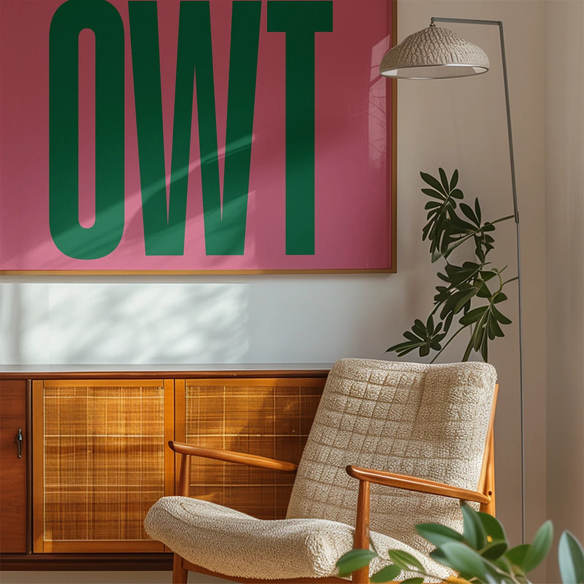 The print in a bedroom, its green lettering on pink adding a modern pop of colour