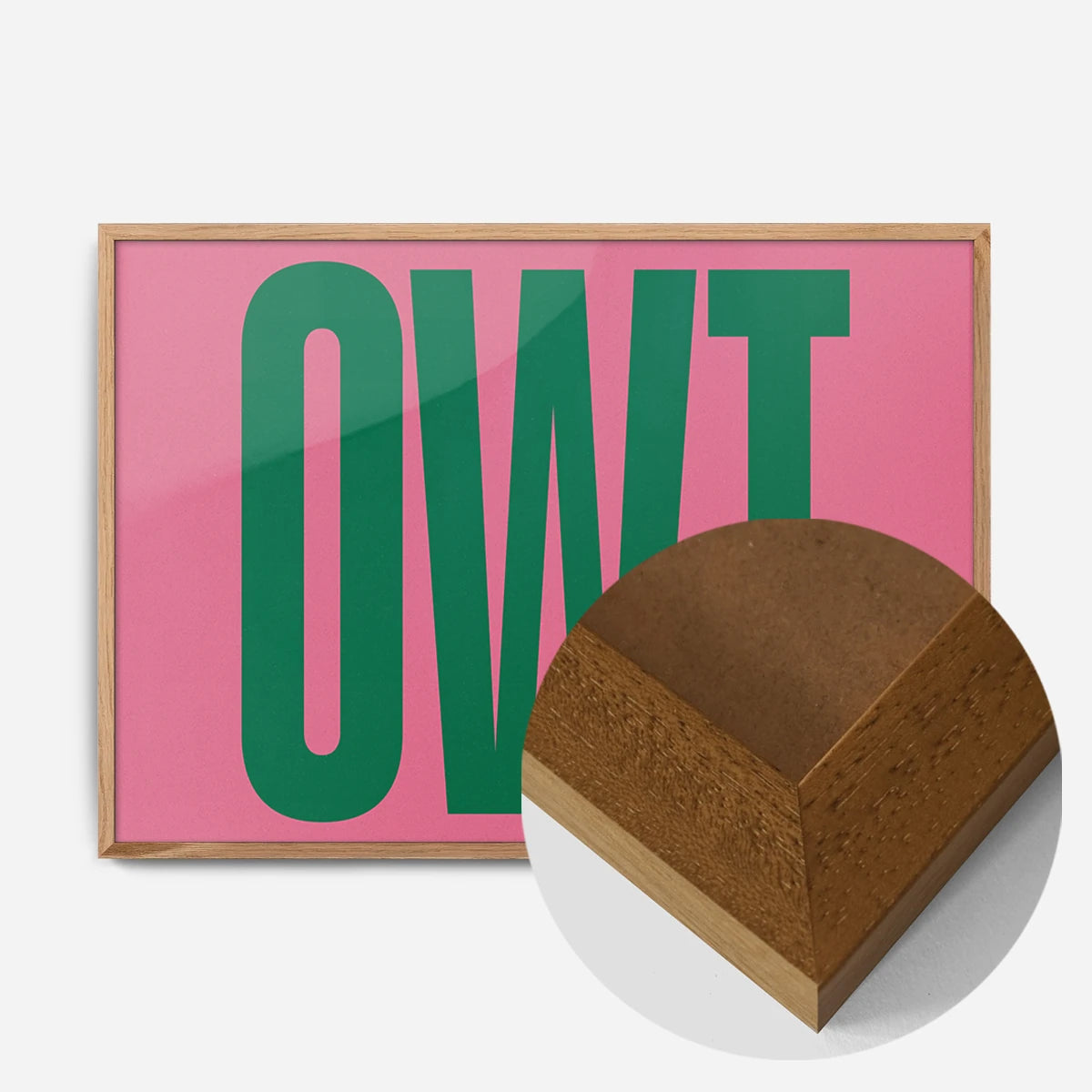 bold green typography print in an oak wood frame, side profile