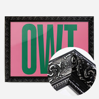 bold green typography print in a black ornate frame, side profile