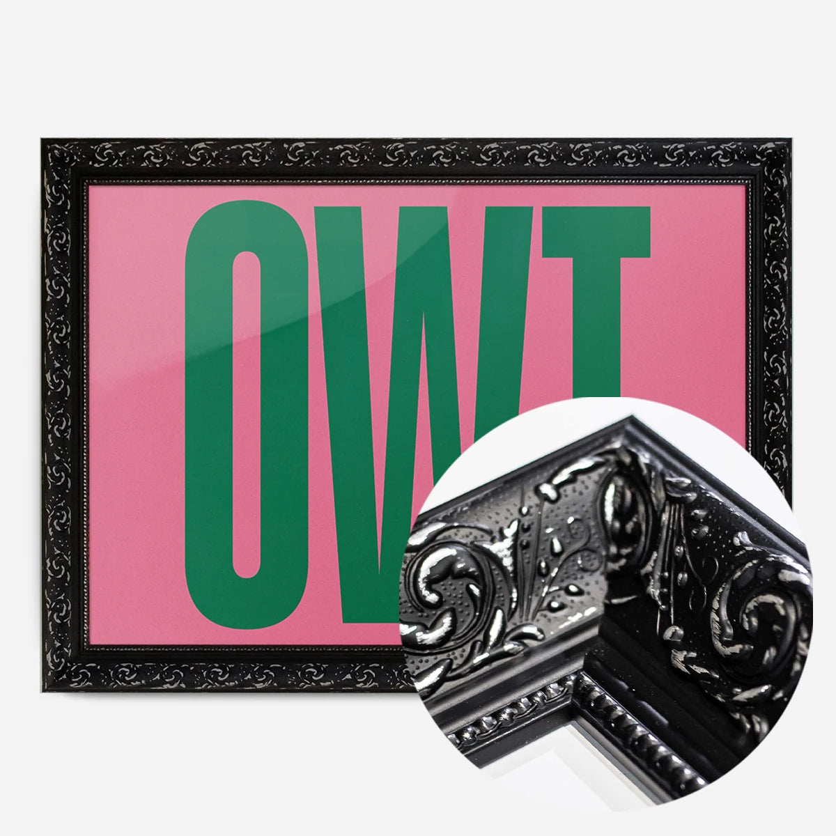 bold green typography print in a black ornate frame, side profile
