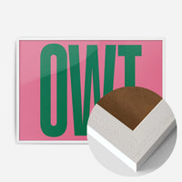 bold green typography print in a white wood frame, side profile