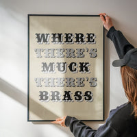 Where There's Muck There's Brass print in a kitchen, vintage-style lettering as wall decor
