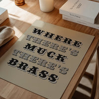 The print in a dining room, bold black and grey Victorian type as a northern saying poster