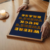 The print in a bedroom, gold and navy lettering on the wall