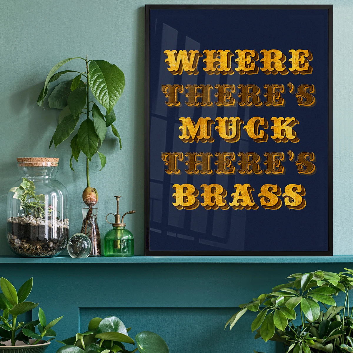 Where There's Muck There's Brass print above a home office desk