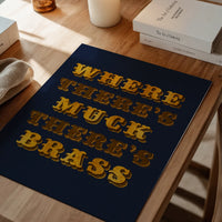 The print on a dining room wall, gold lettering on navy