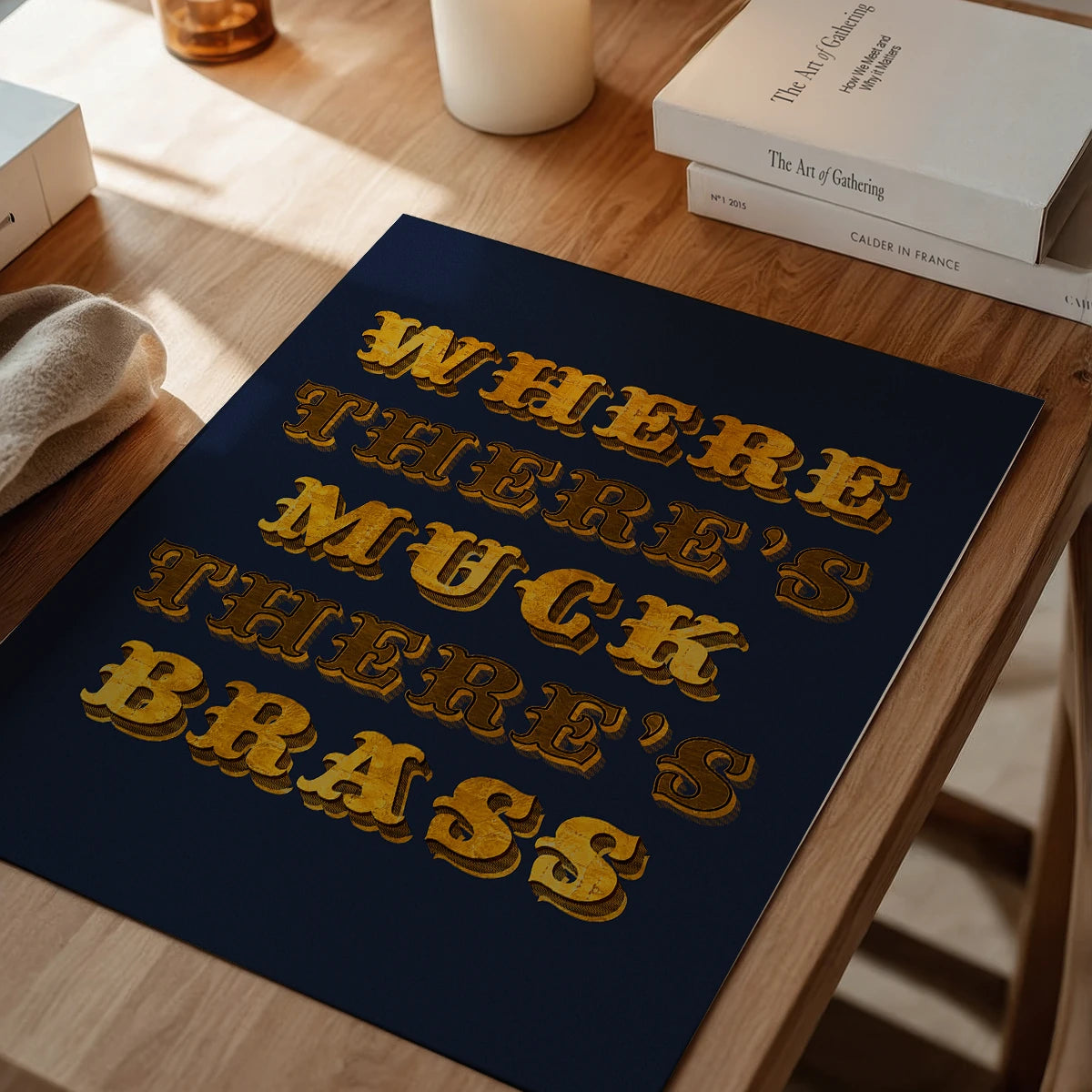 The print on a dining room wall, gold lettering on navy