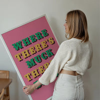 Where There's Muck There's Brass print framed on a living room wall, bold pink northern saying typography