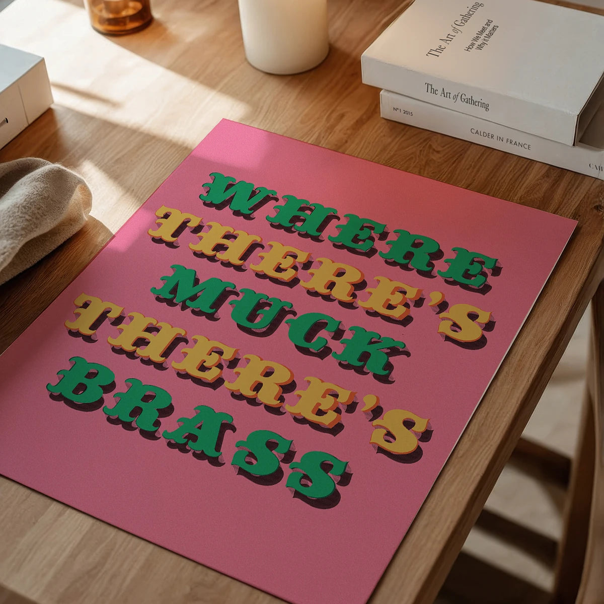 Pink and green typography print on a dining room wall adding retro character