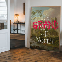 Framed typography abbey landscape print hanging in a bright hallway