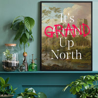 It's Grand Up North typography print above a desk in a home office