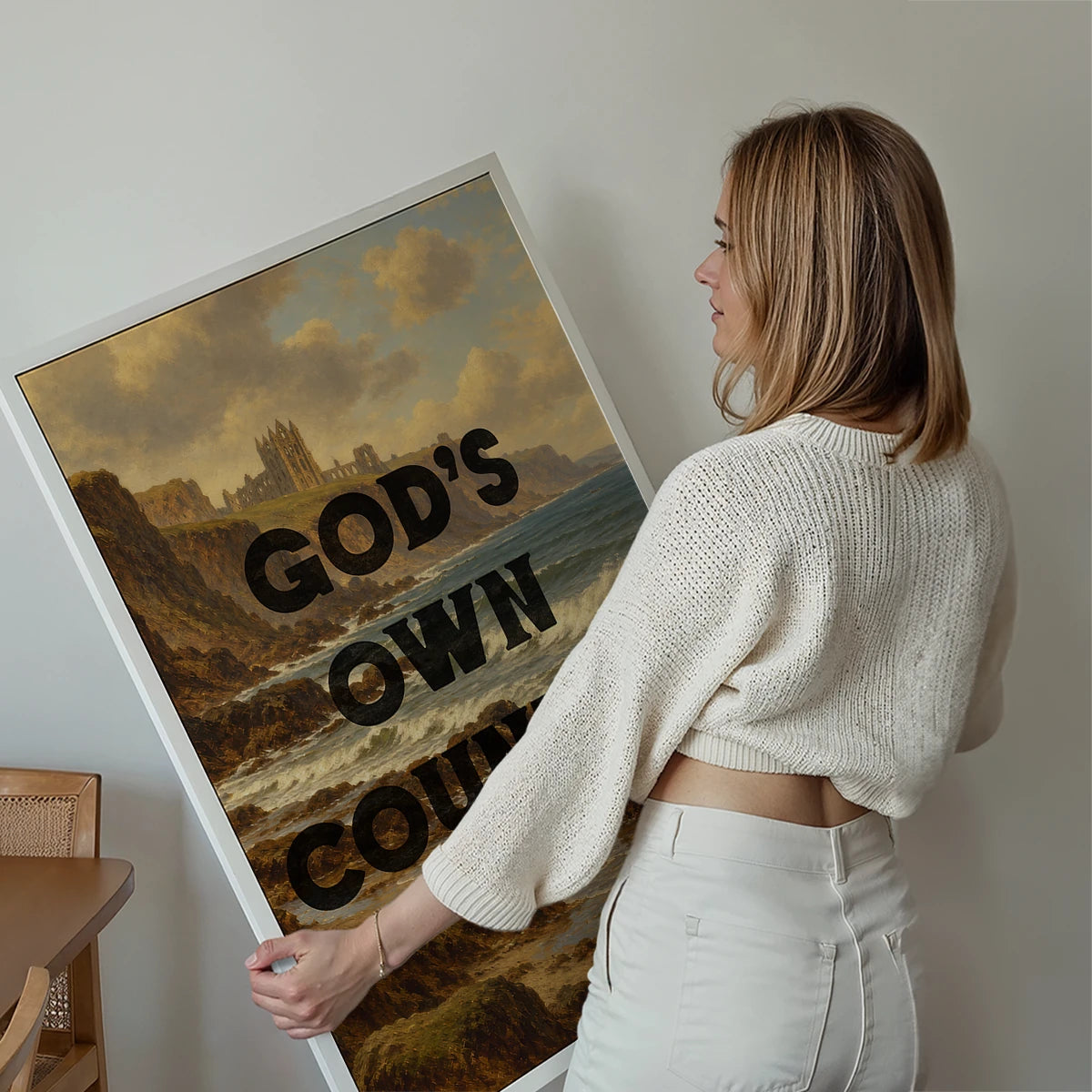 God's Own Country God's Own Country print above a sofa in a living room