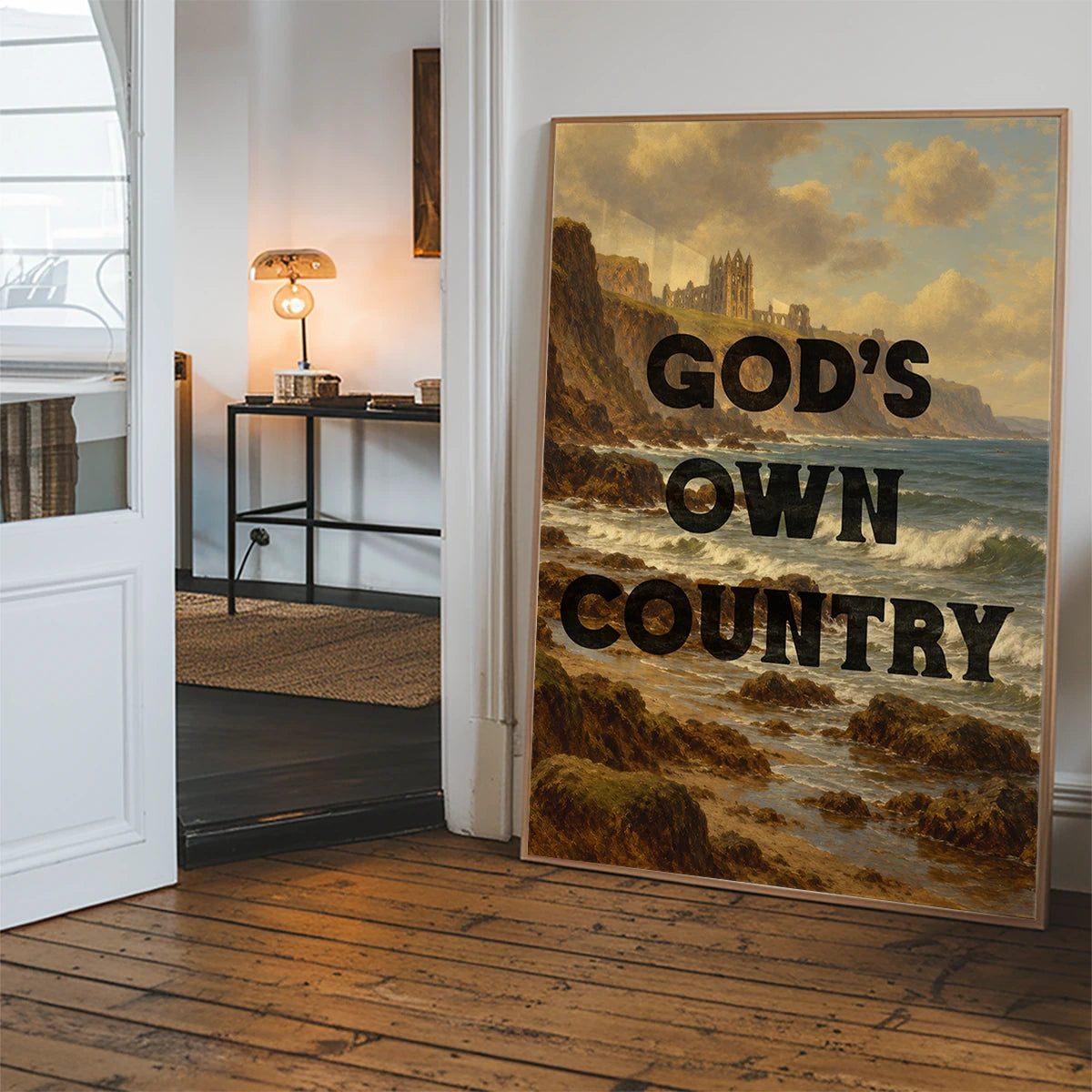 Typography coastal abbey landscape print displayed on a hallway wall